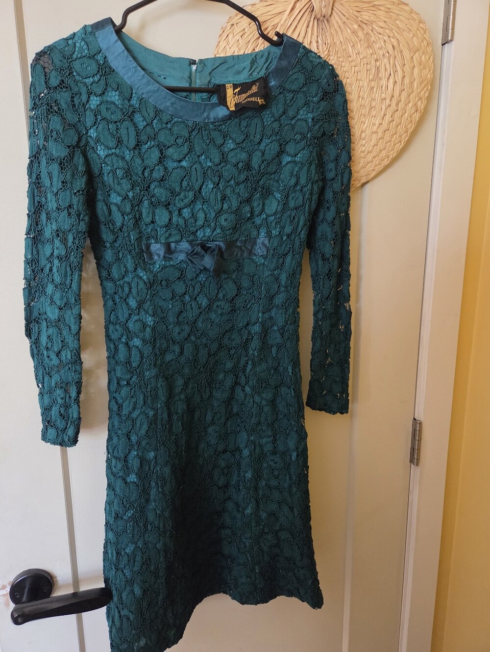 This vintage emerald green lace cocktail dress by the European brand Famosella